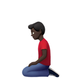 knielende man: donkere huidskleur