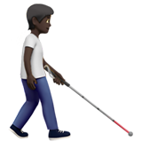 persoon met taststok: donkere huidskleur, naar rechts gericht